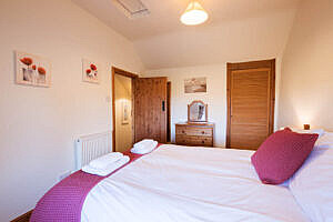 The double bedroom in the cottage looking towards the door