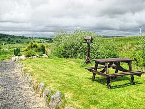 Picnic bench and table view of surrounding mountains