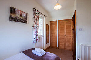 The twin bedroom in the cottage looking towards the door